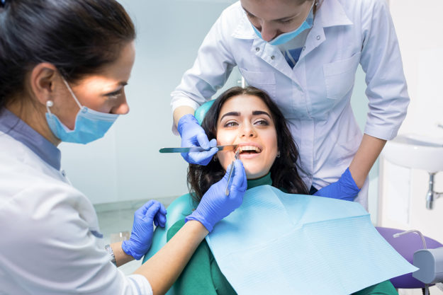a woman getting work done after asking what are dental implants