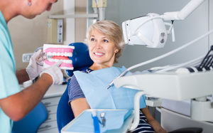 woman getting fitted for dentures