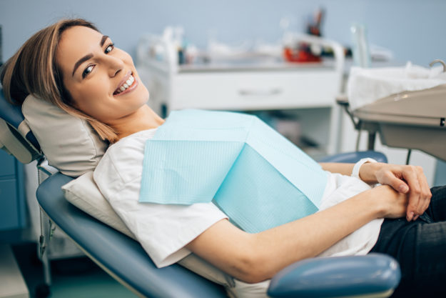 a woman at the dentists after finding saturday dental appointments