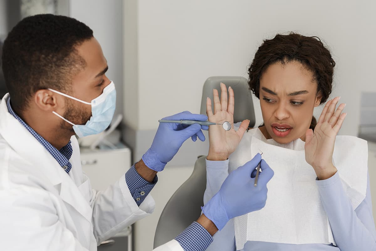 a woman trying to overcome her dentophobia