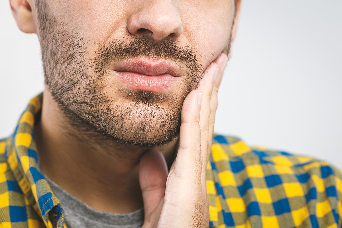 Signs of a Dental Cavity man showing signs of a dental cavity