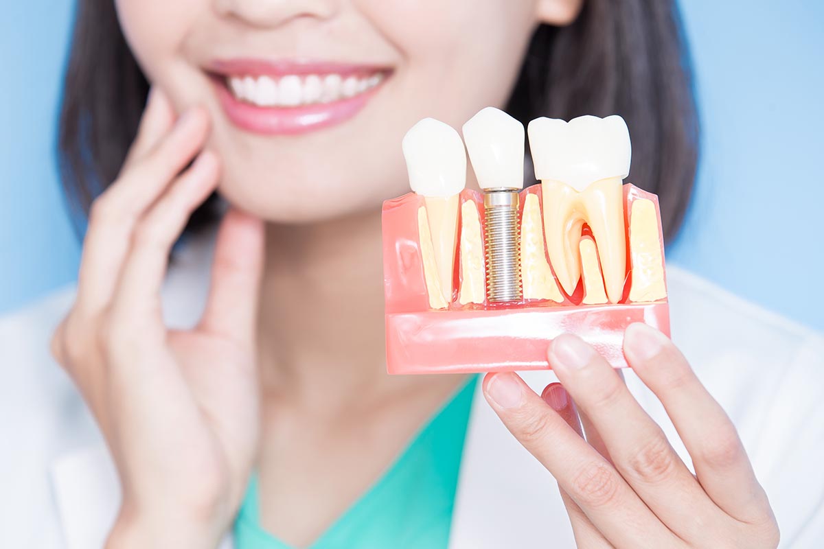 dentist explaining a single tooth implant