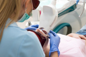 a man undergoes a teeth whitening procedure